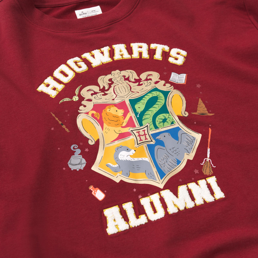 Close up detail shot of a Hogwarts Alumni Adult Crewneck Sweatshirt