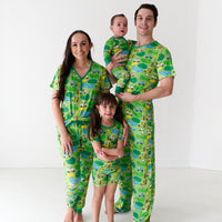Family of four wearing matching Fairway Fun pajamas