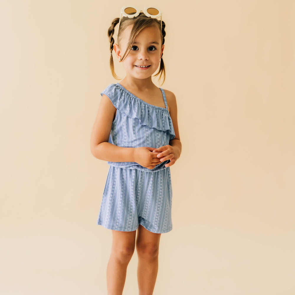 Child wearing an Island stripe asymmetrical romper