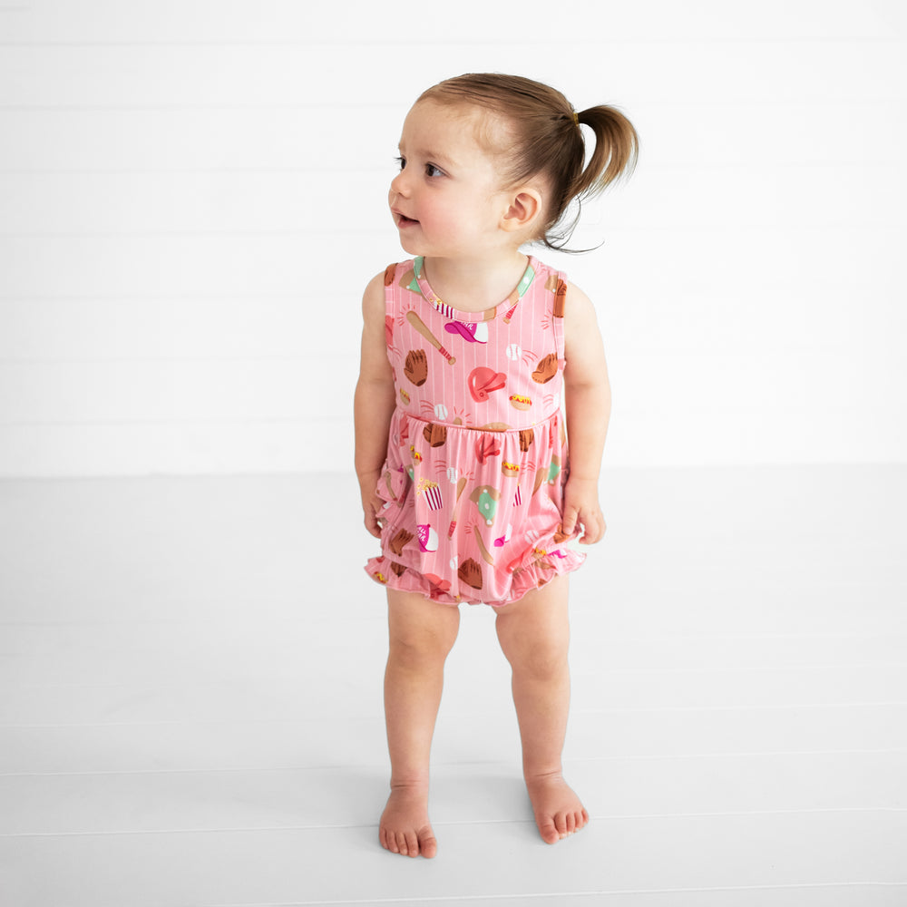 Image of a child wearing a Pink All Stars Bubble Romper