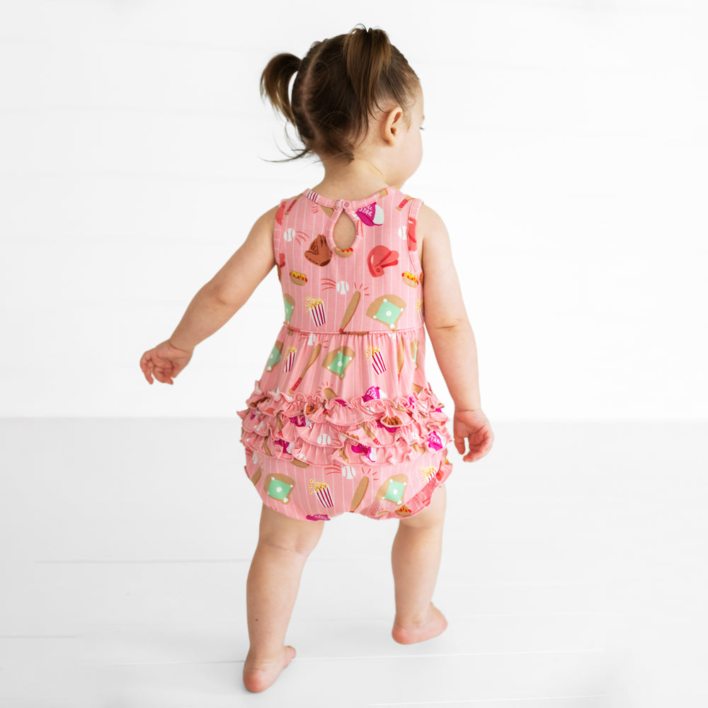 Back view image of a child wearing a Pink All Stars Bubble Romper