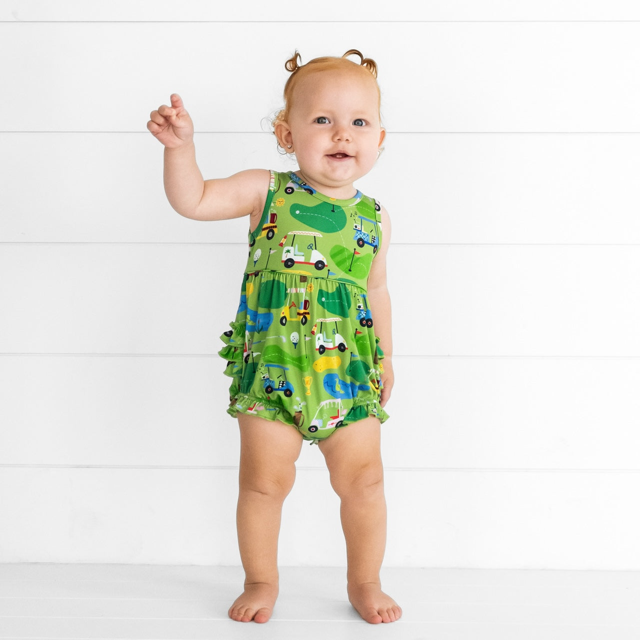 Image of a child wearing a Fairway Fun Bubble Romper