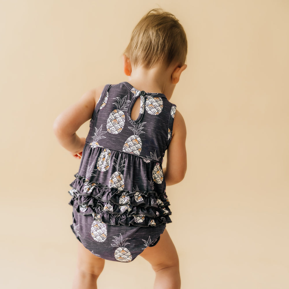 Back view showing the ruffles on a Sweet Paradise bubble romper