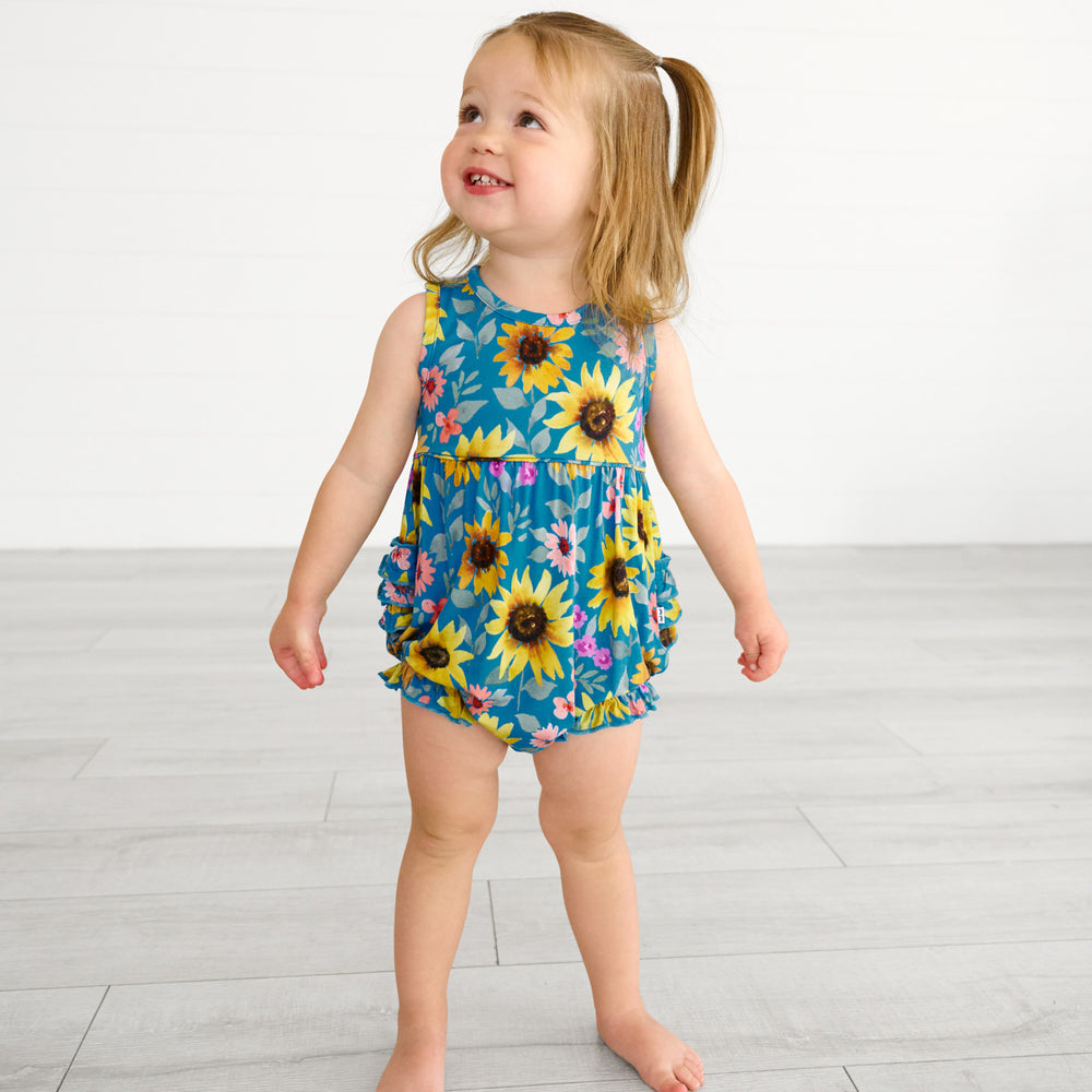 Image of a child wearing a Sunflower Fields Bubble Romper