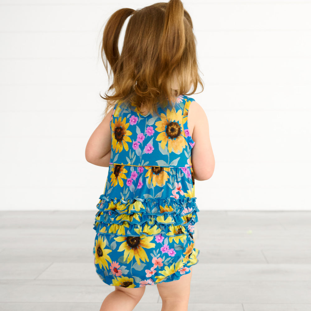 Back view image of a child wearing a Sunflower Fields Bubble Romper