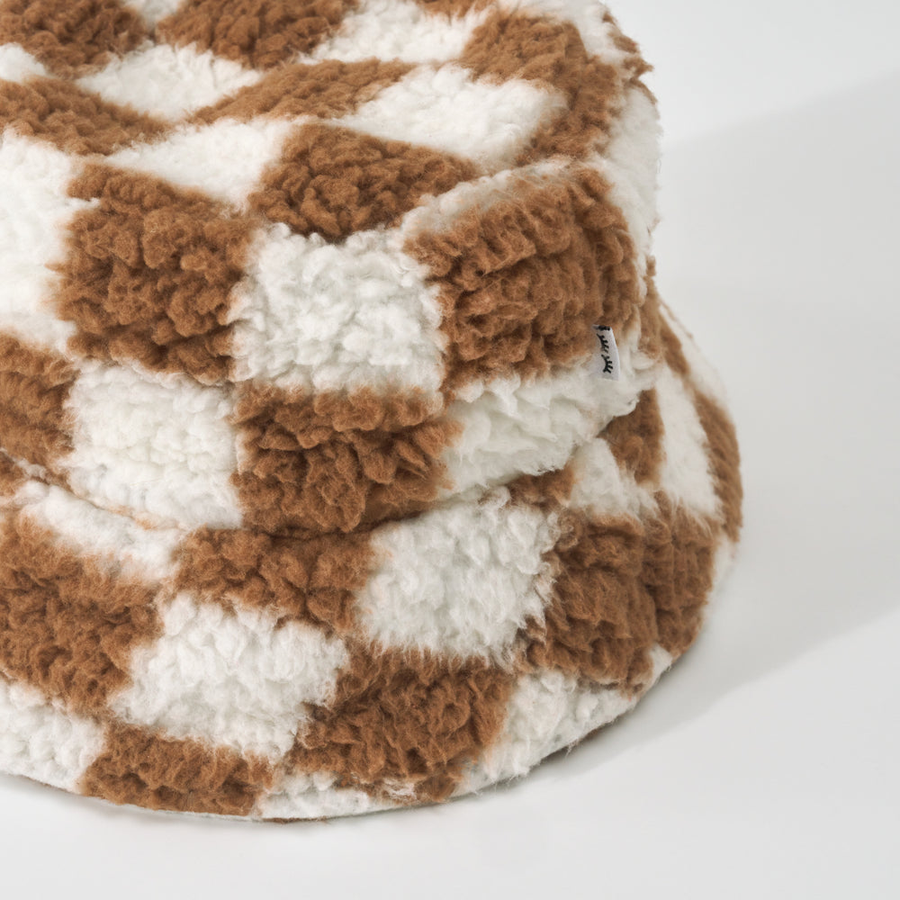 Close up detail shot of a Caramel Checks Sherpa Bucket Hat