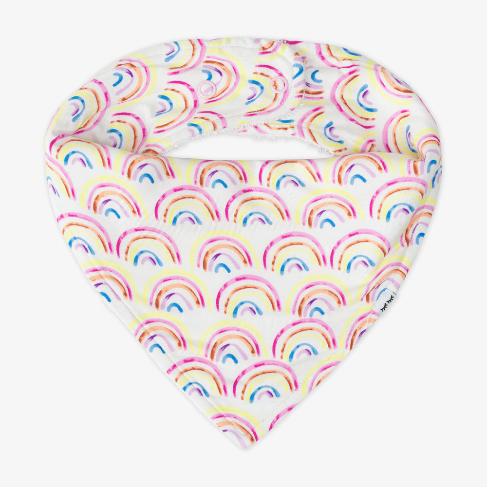 Flat lay image of a Pastel Rainbows bandana bib