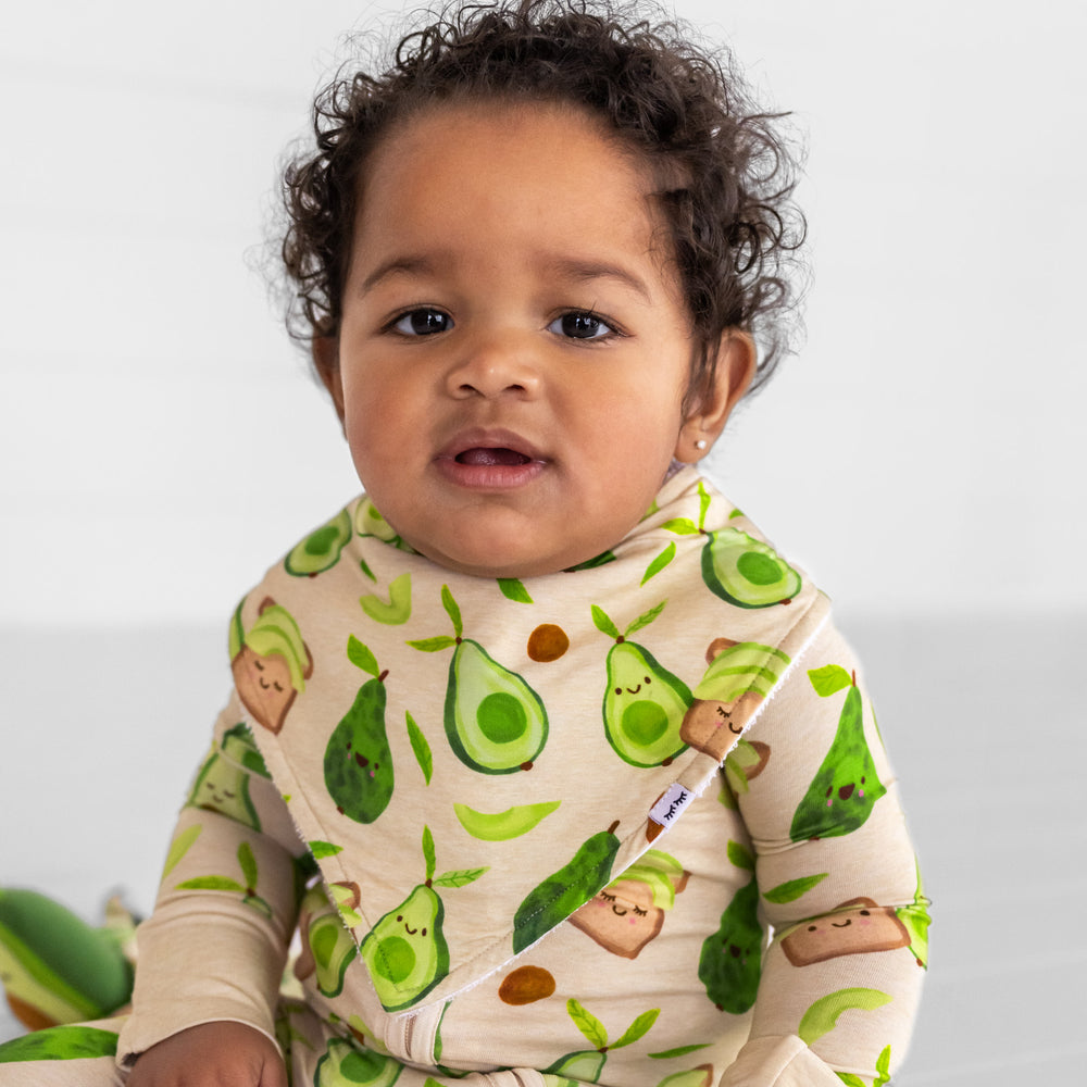  image of a child wearing an Avocado Toast bandana bib