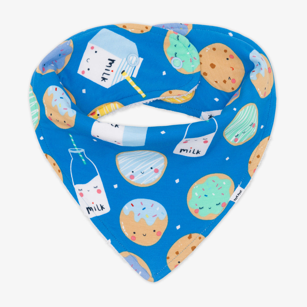 Flat lay image of a blue cookies and milk bandana bib