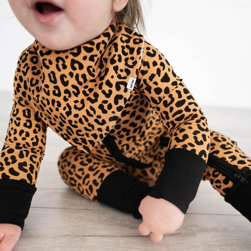 close up image of a child wearing a Classic Leopard printed bib