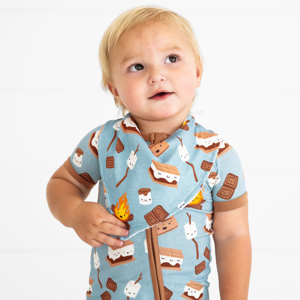 Close up image of a child wearing a S'mores Galore bandana bib