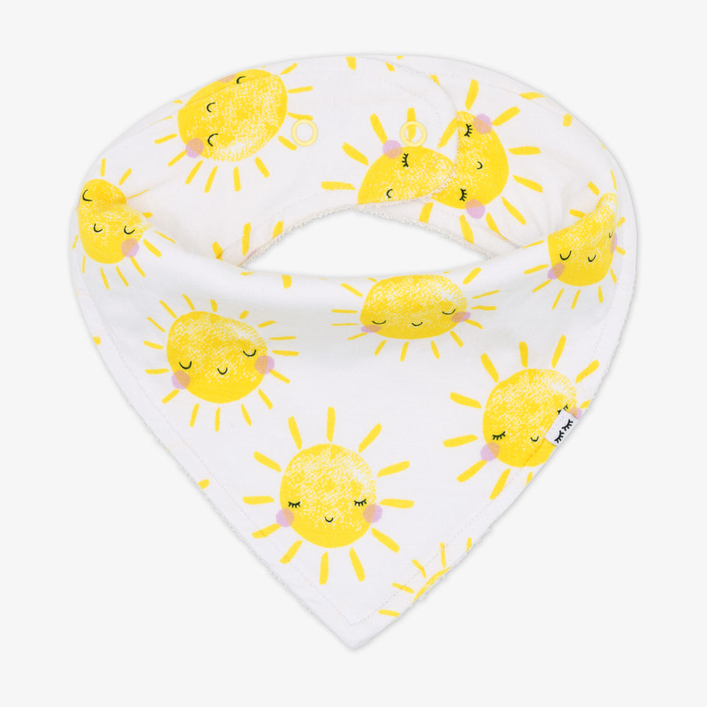 Flat lay image of a Sunshine printed bandana bib