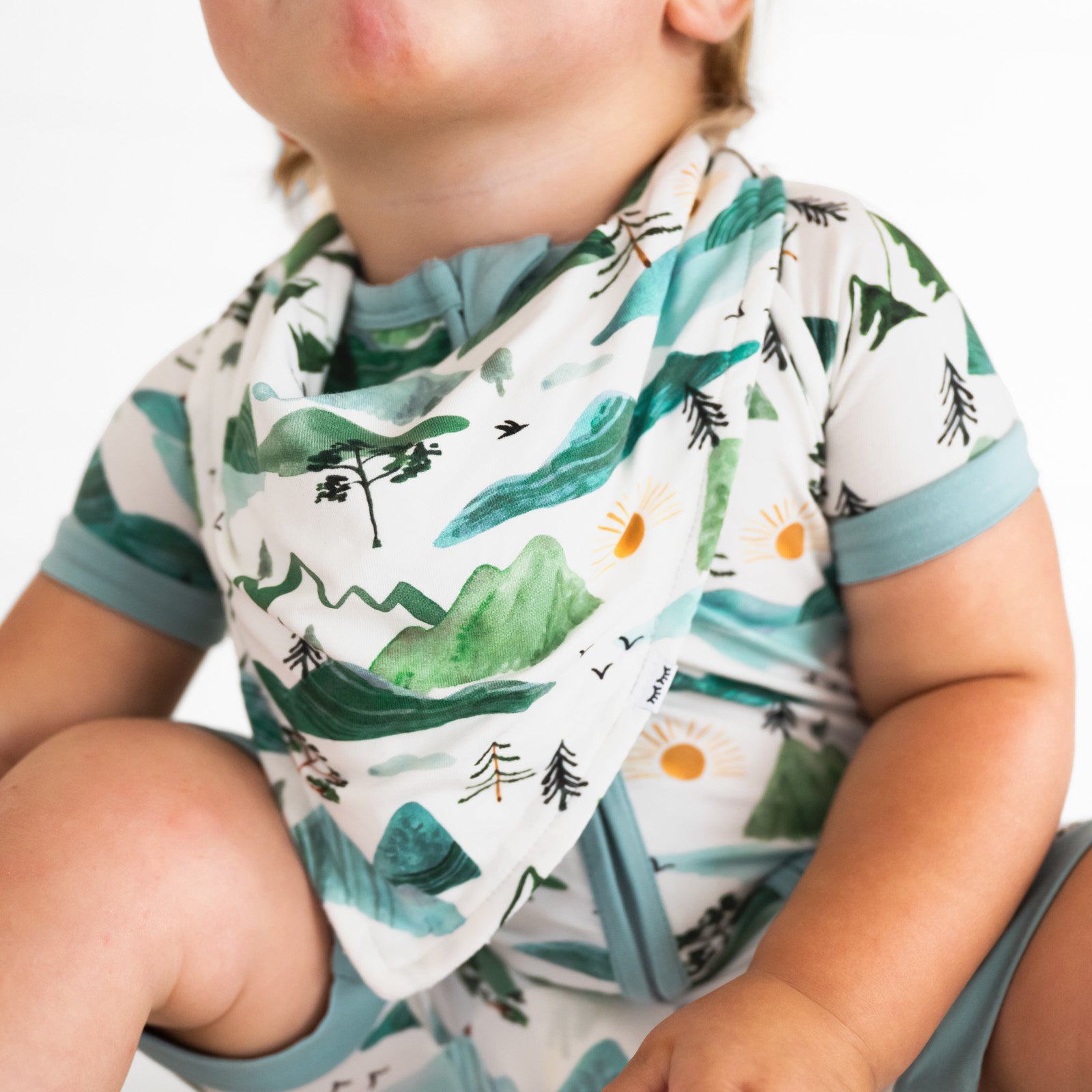 close up image of a child wearing a Mountain Mist bandana bib