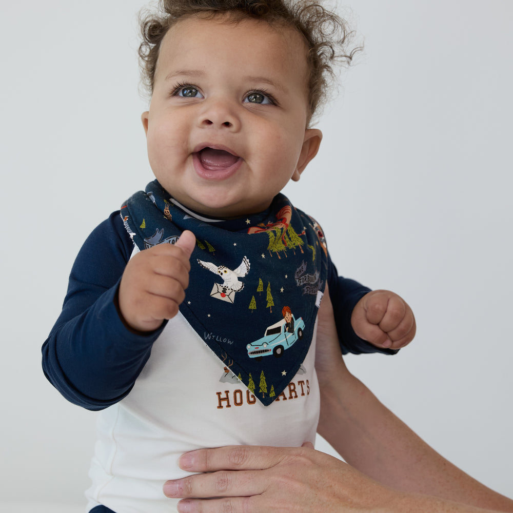 Image of a child wearing an Evening at Hogwarts bandana bib