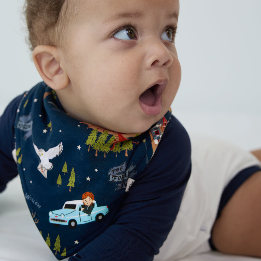 Child playing wearing an Evening at Hogwarts bandana bib