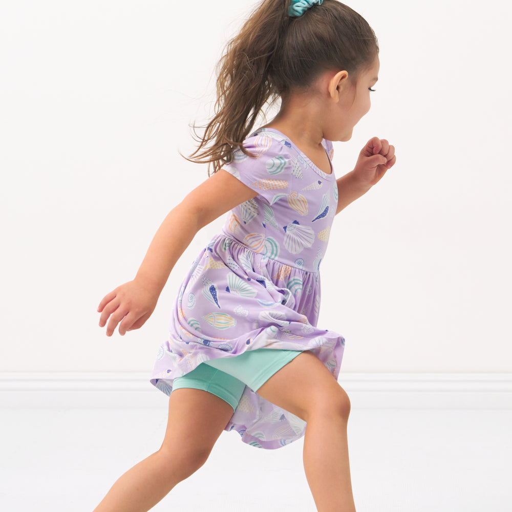 Child wearing Ocean Waves bike shorts and coordinating Play dress