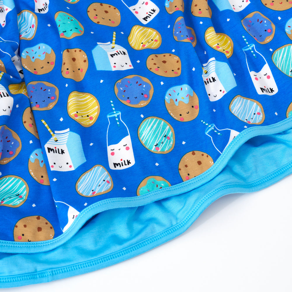 Close up shot of blue cookies & milk blanket
