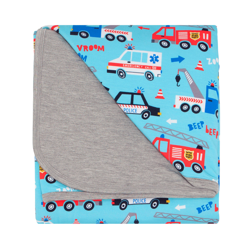 Flat lay image of a To The Rescue cloud blanket showing the Heather Gray solid backing