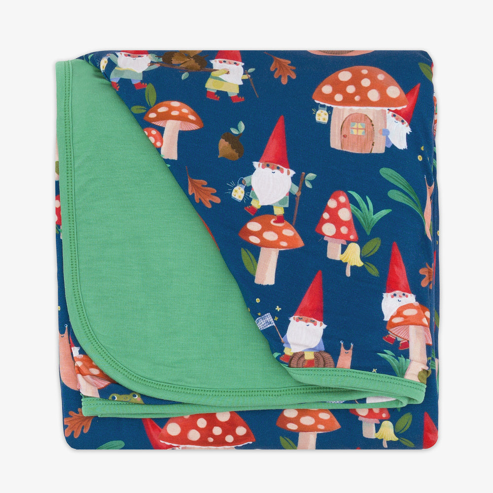 Flat lay image of the Forest Gnomes Large Cloud Blanket® folded