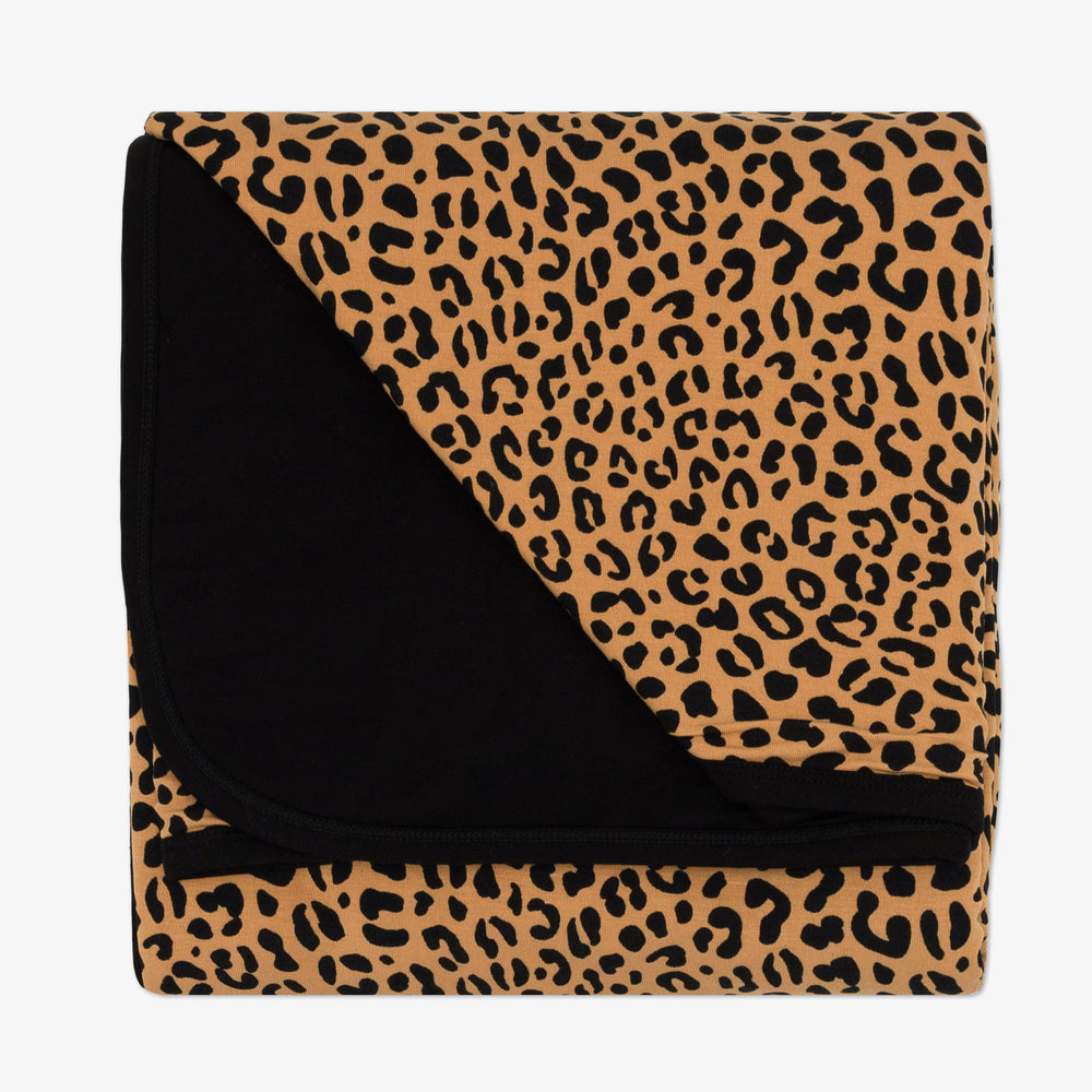 Flat lay image of the Classic Leopard Large Cloud Blanket® folded