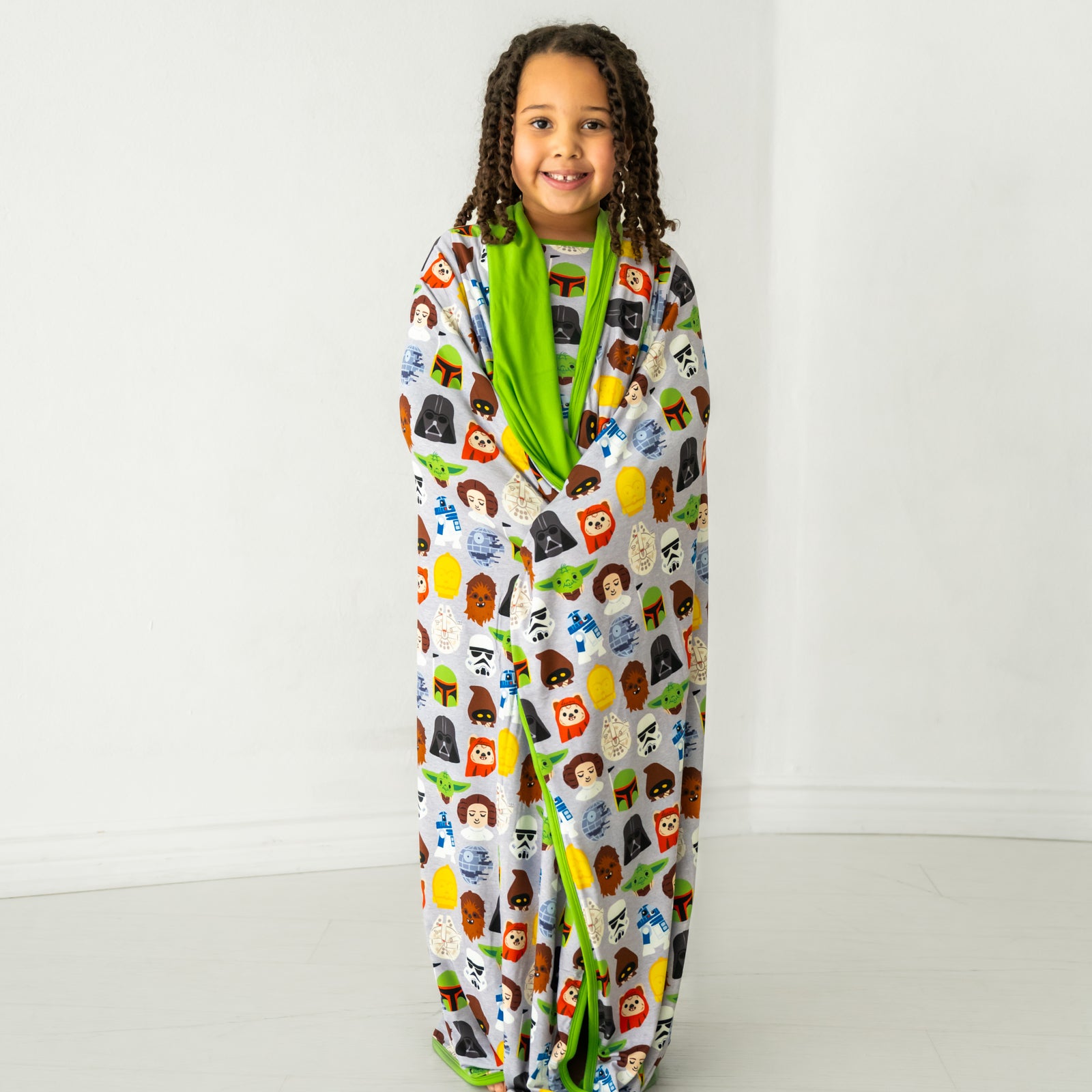 Child wrapped up in a Legends of the Galaxy large cloud blanket