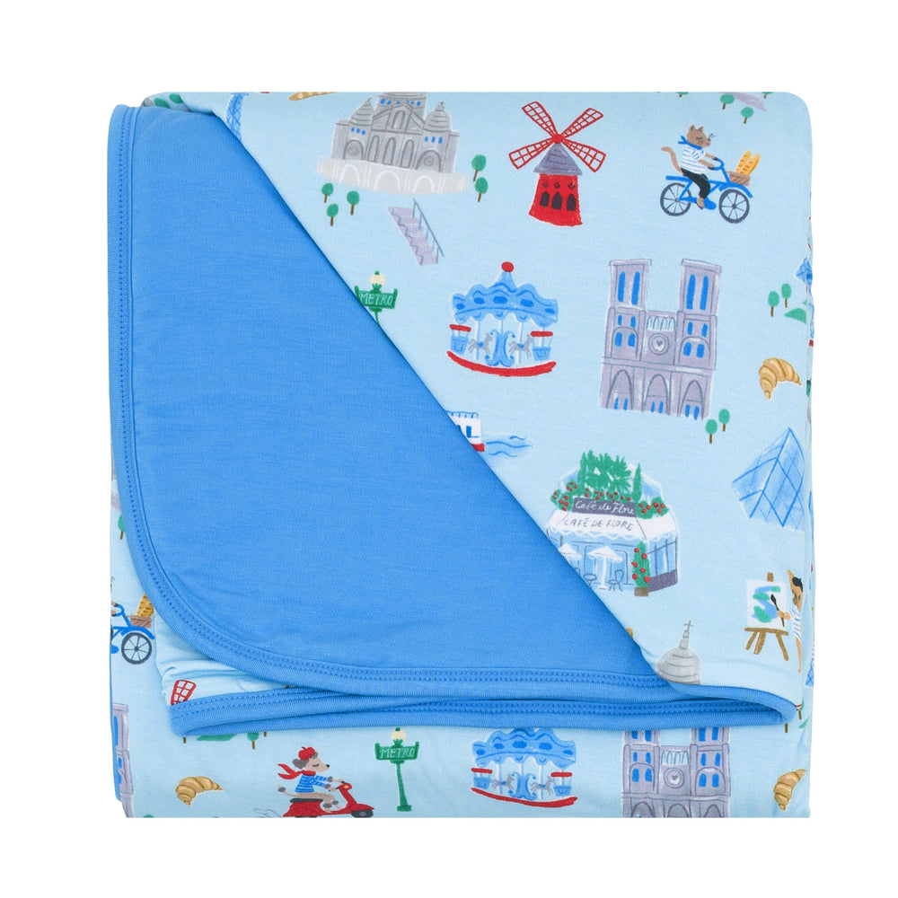 Flat lay image of the Blue Weekend in Paris Large Cloud Blanket® folded
