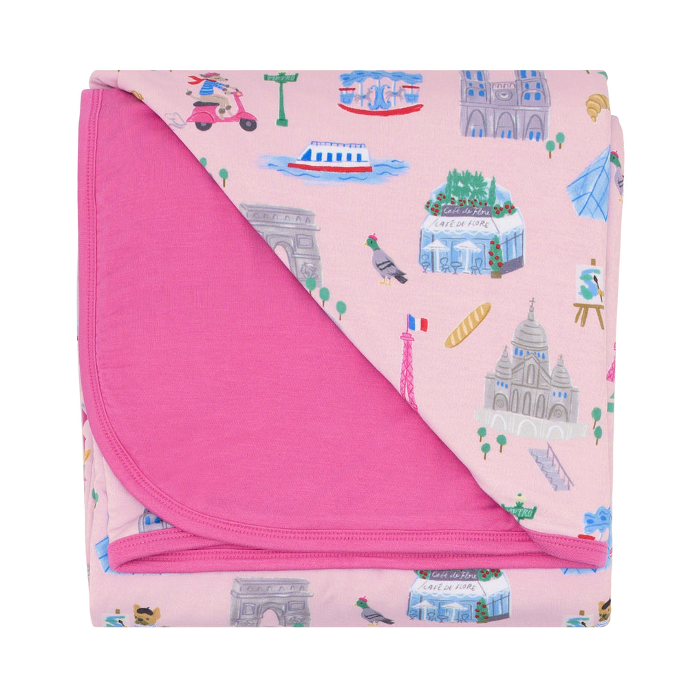 Flat lay image of the Pink Weekend in Paris Large Cloud Blanket® folded