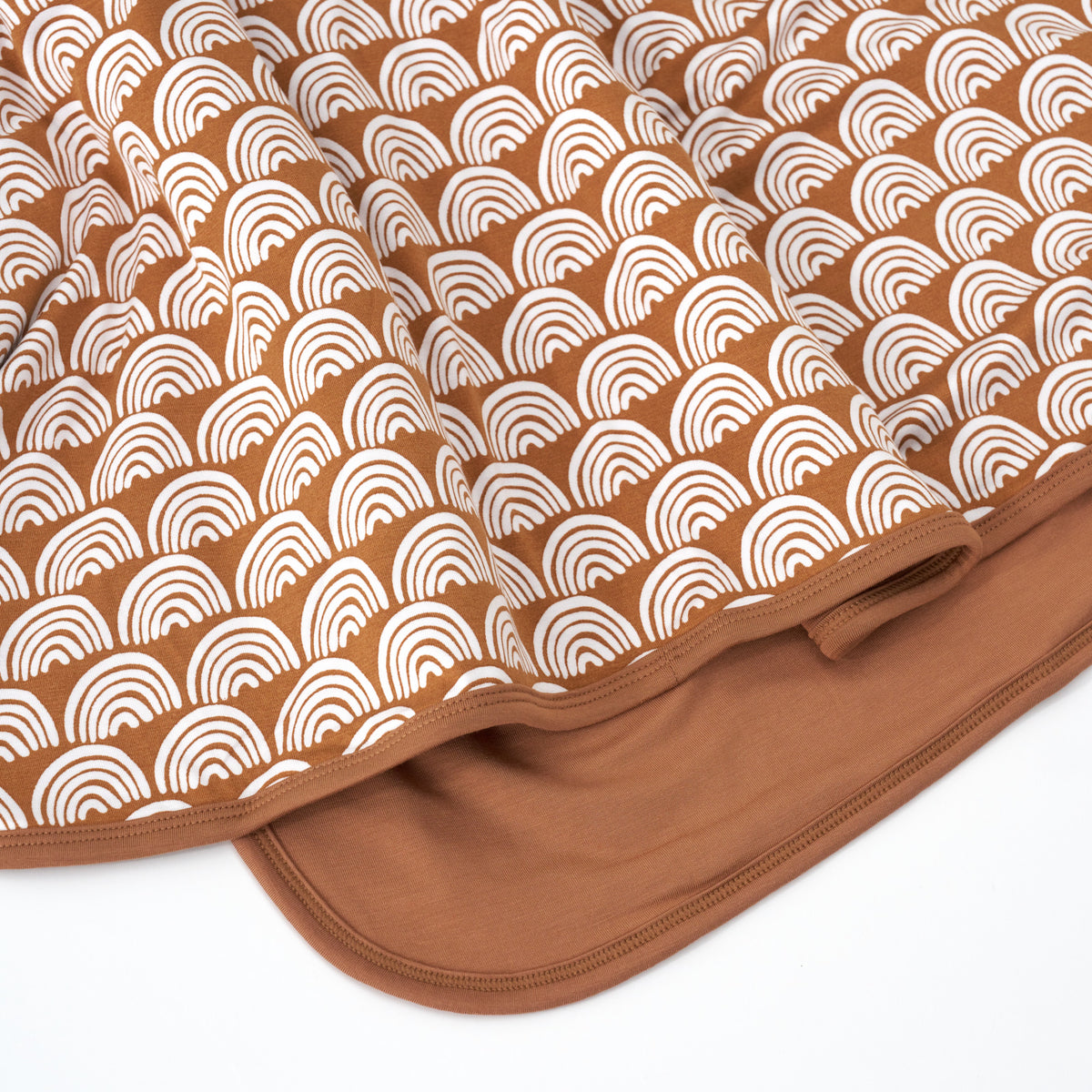 close up shot of rust rainbows blanket