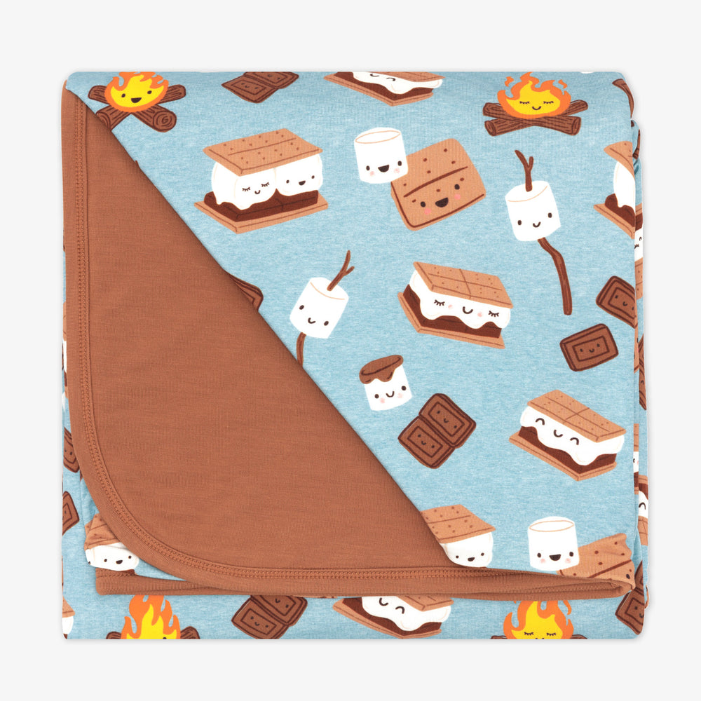 flat lay image of a S'more Galore cloud blanket showing the solid brown backing