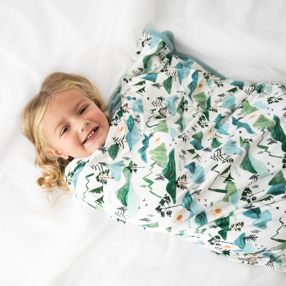 close up image of of a child wrapped up in a Mountain Mist cloud blanket