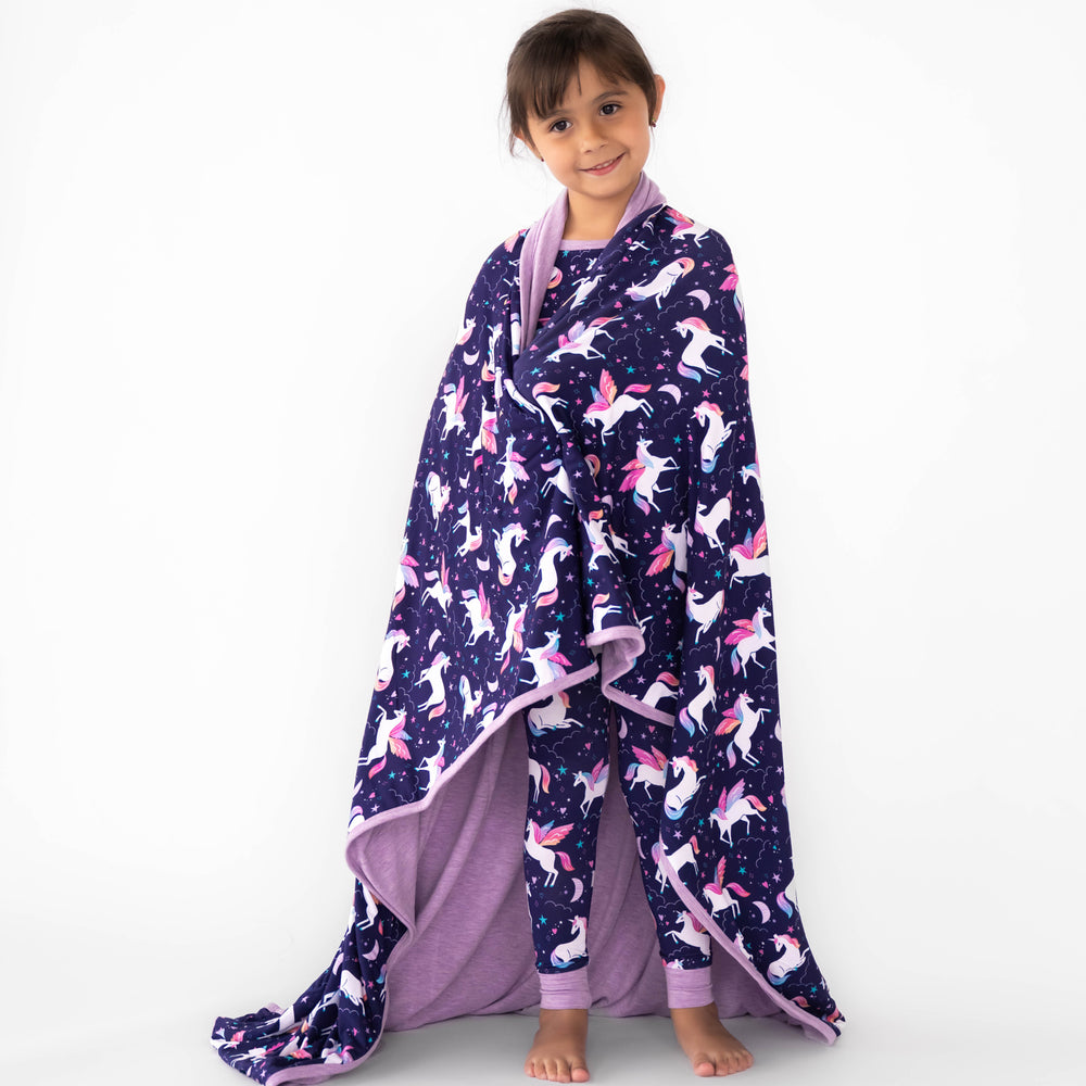 Child wrapped in the Magical Skies Large Cloud Blanket®