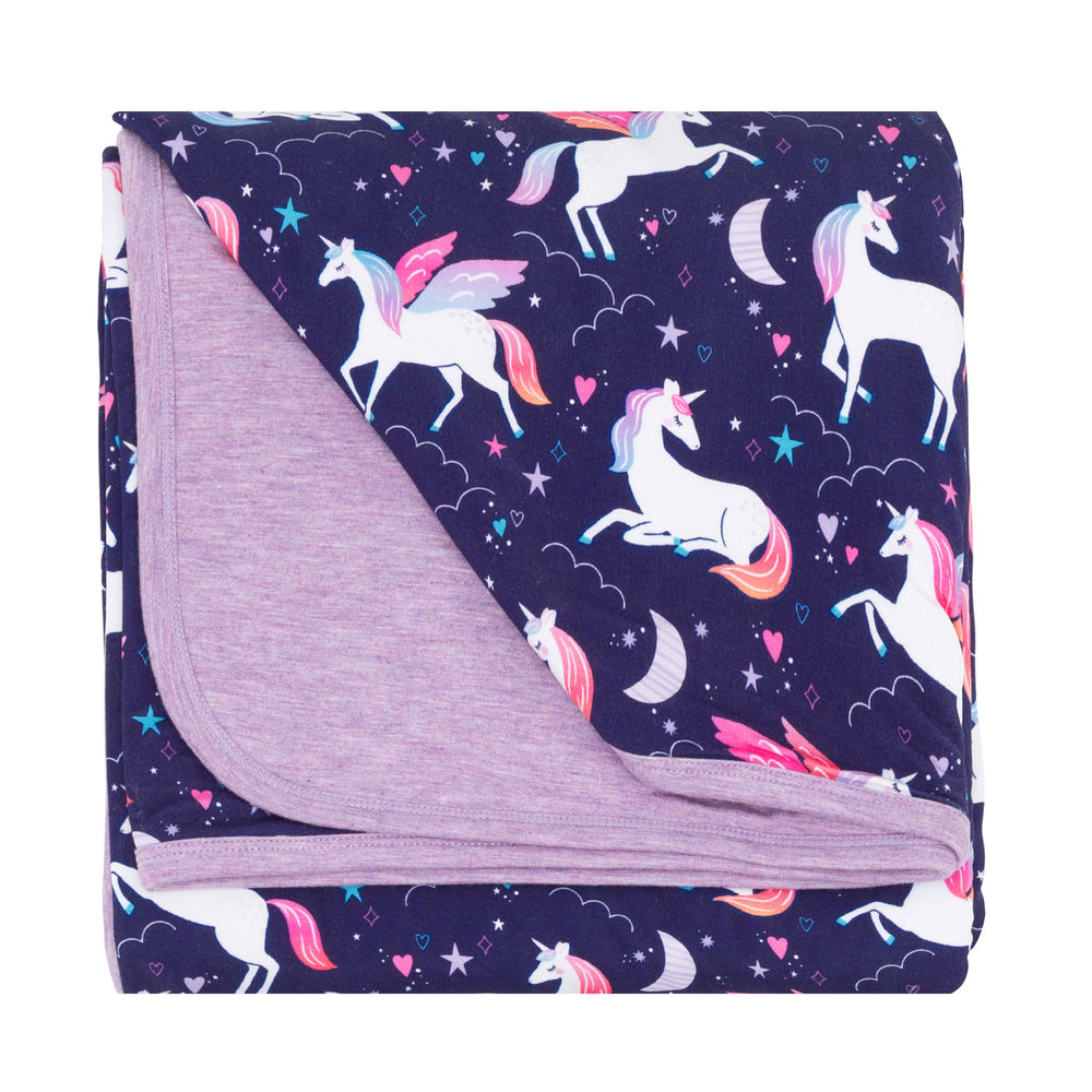 Flat lay image of the Magical Skies Large Cloud Blanket® folded
