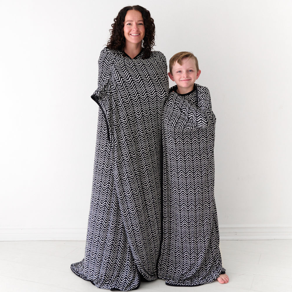 Mother and child wrapped up in matching Monochrome Chevron cloud blankets
