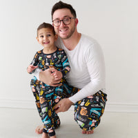 Father and son wearing matching pajamas