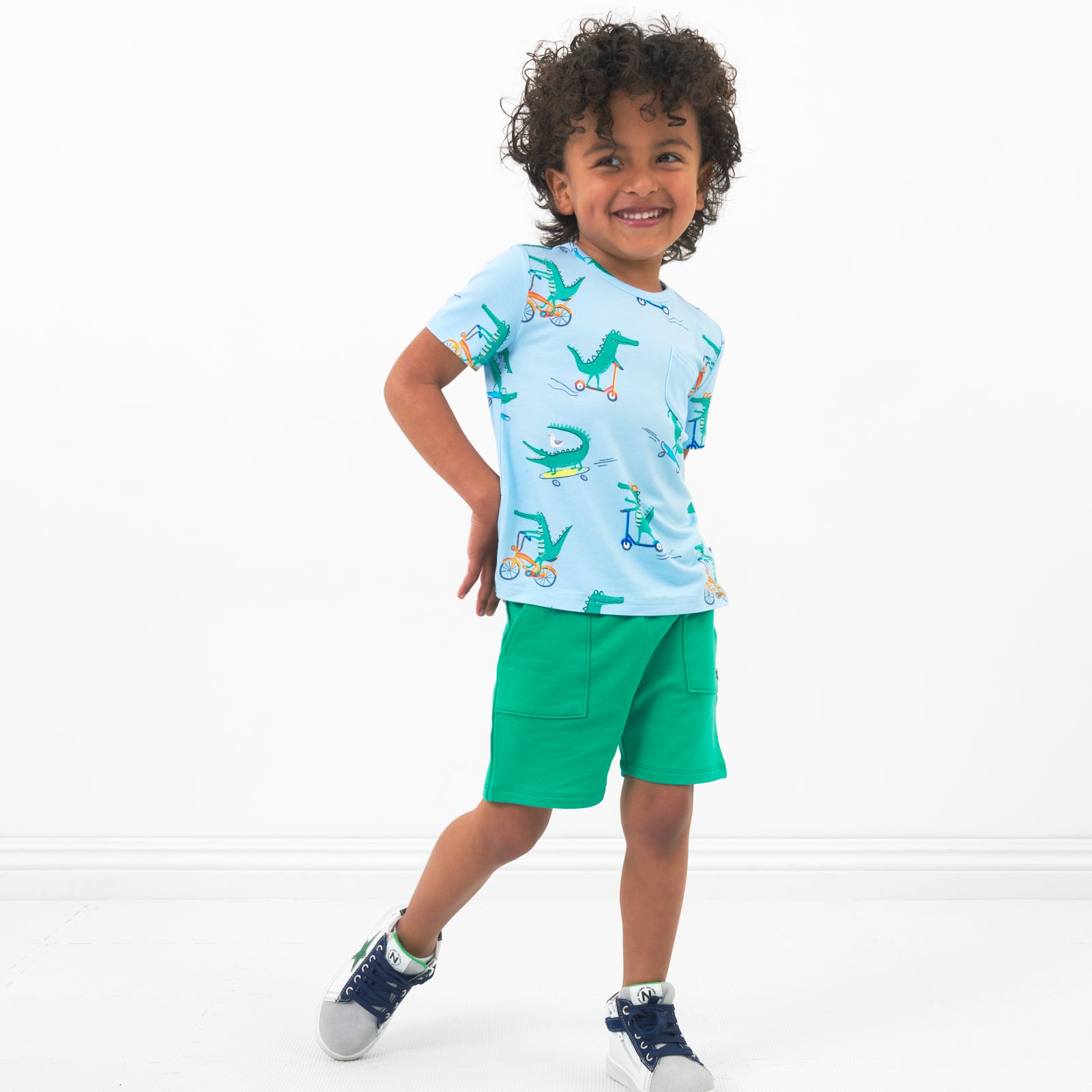 Child wearing Marine Green shorts and coordinating top