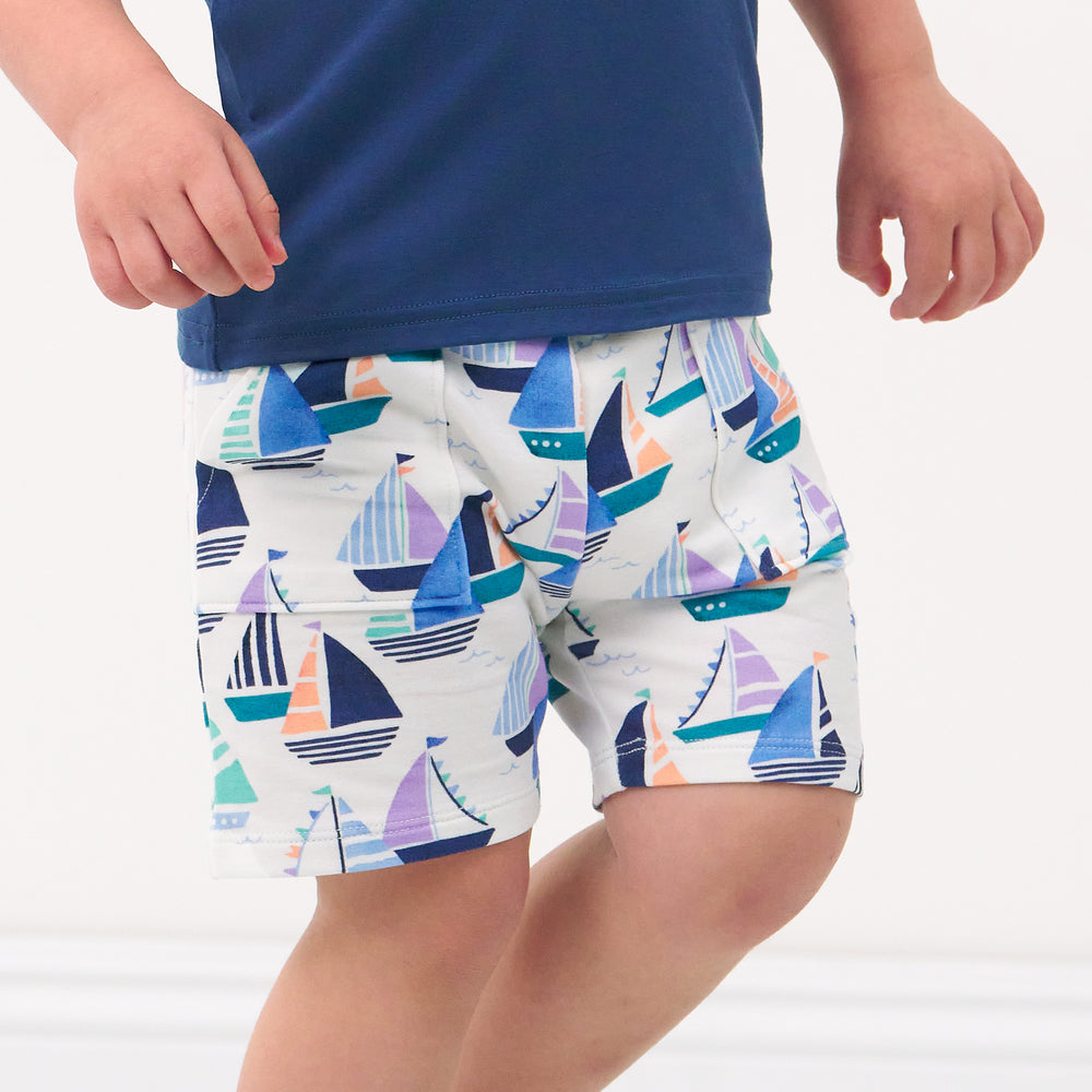 Close up image of a child wearing Seas the Day shorts