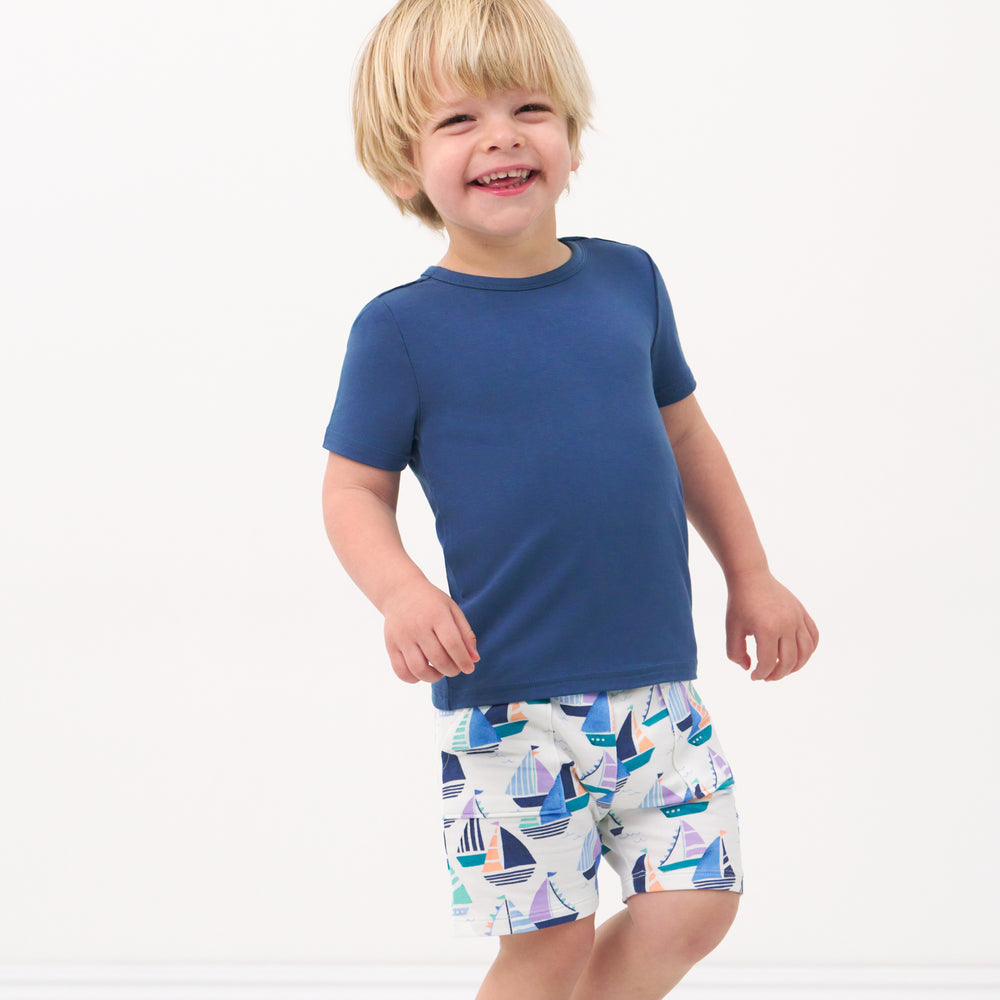 Child wearing Seas the Day shorts paired with a Vintage Navy tee