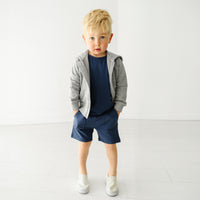Alternate image of a child wearing Vintage Navy shorts and coordinating Play top and zip up hoodie