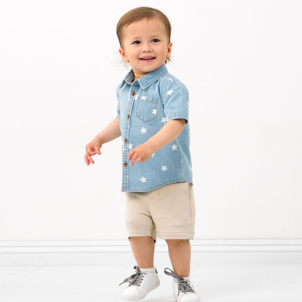 Child wearing a Denim Stars button down polo and coordinating Play shorts