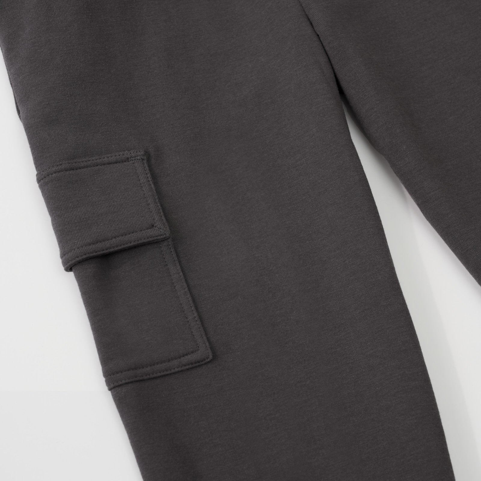 Close up view of a cargo pocket on a Washed Black cargo jogger