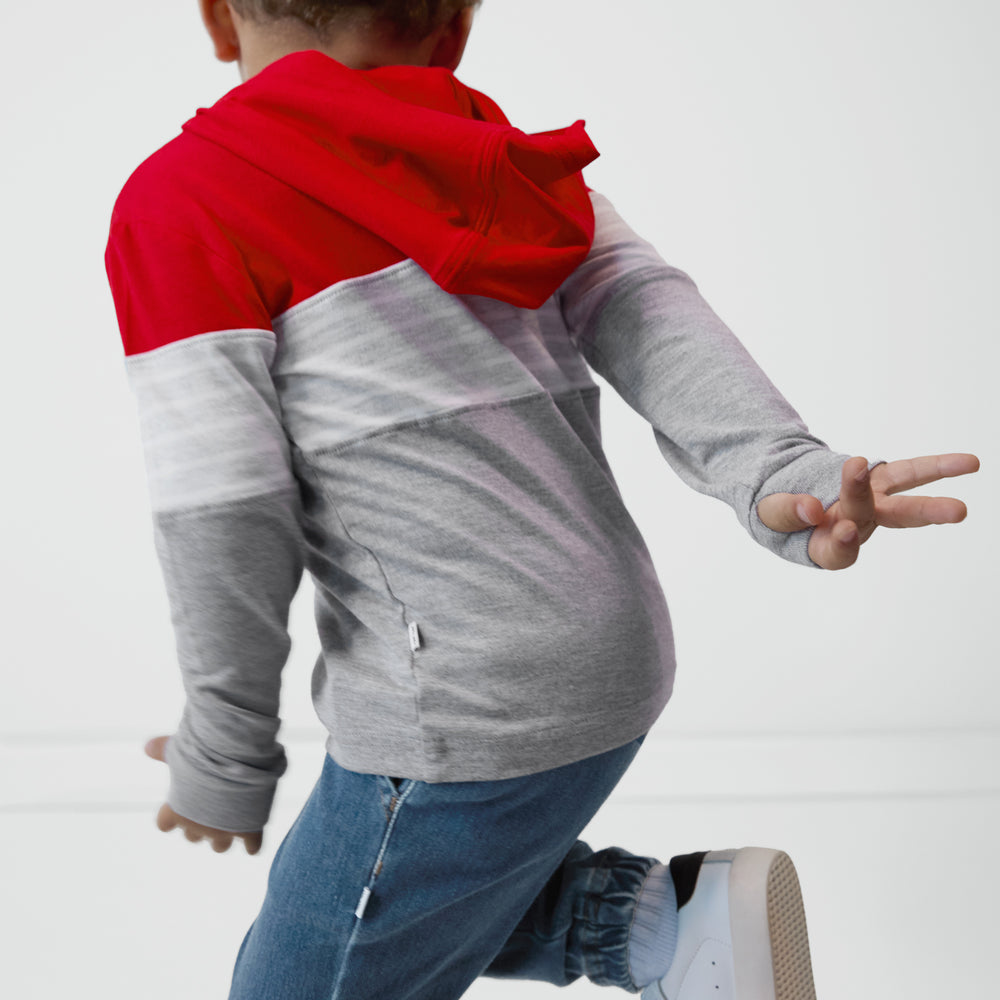 Back view of a child wearing a Candy Red Colorblock Hooded Tee