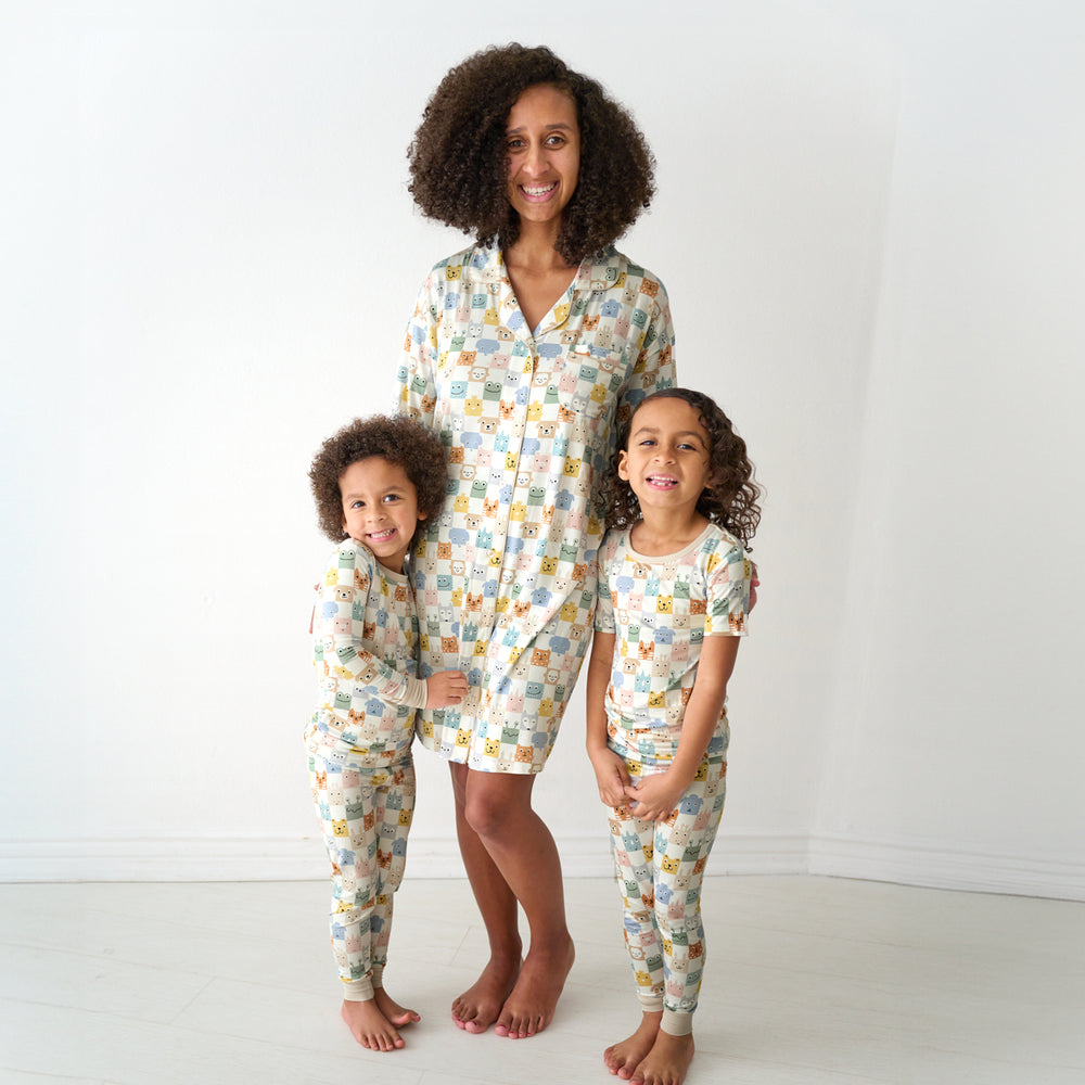 Mother and two children wearing matching Check Mates pajamas