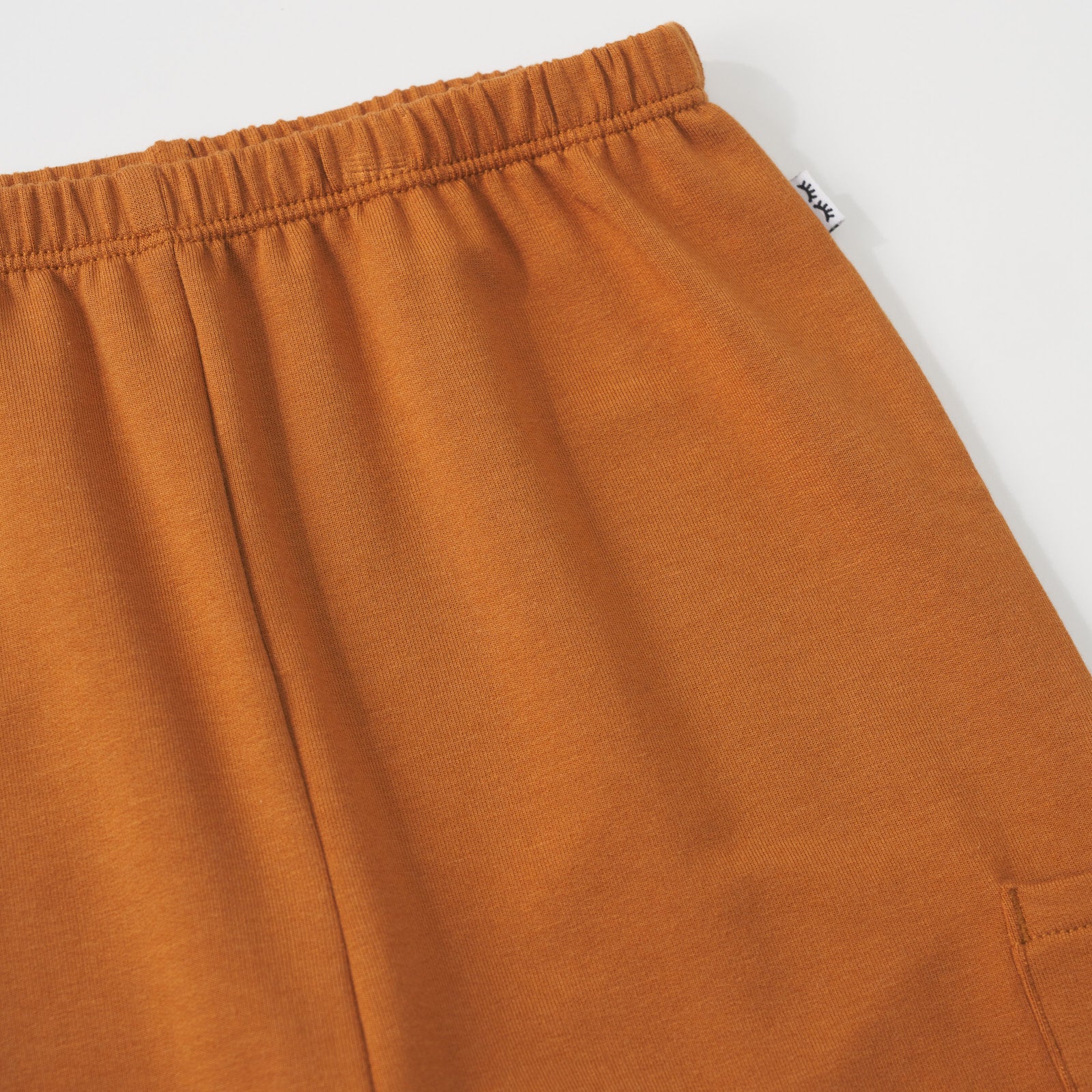 Close-up view of the cinched waistband of a Golden Brown cinched jogger