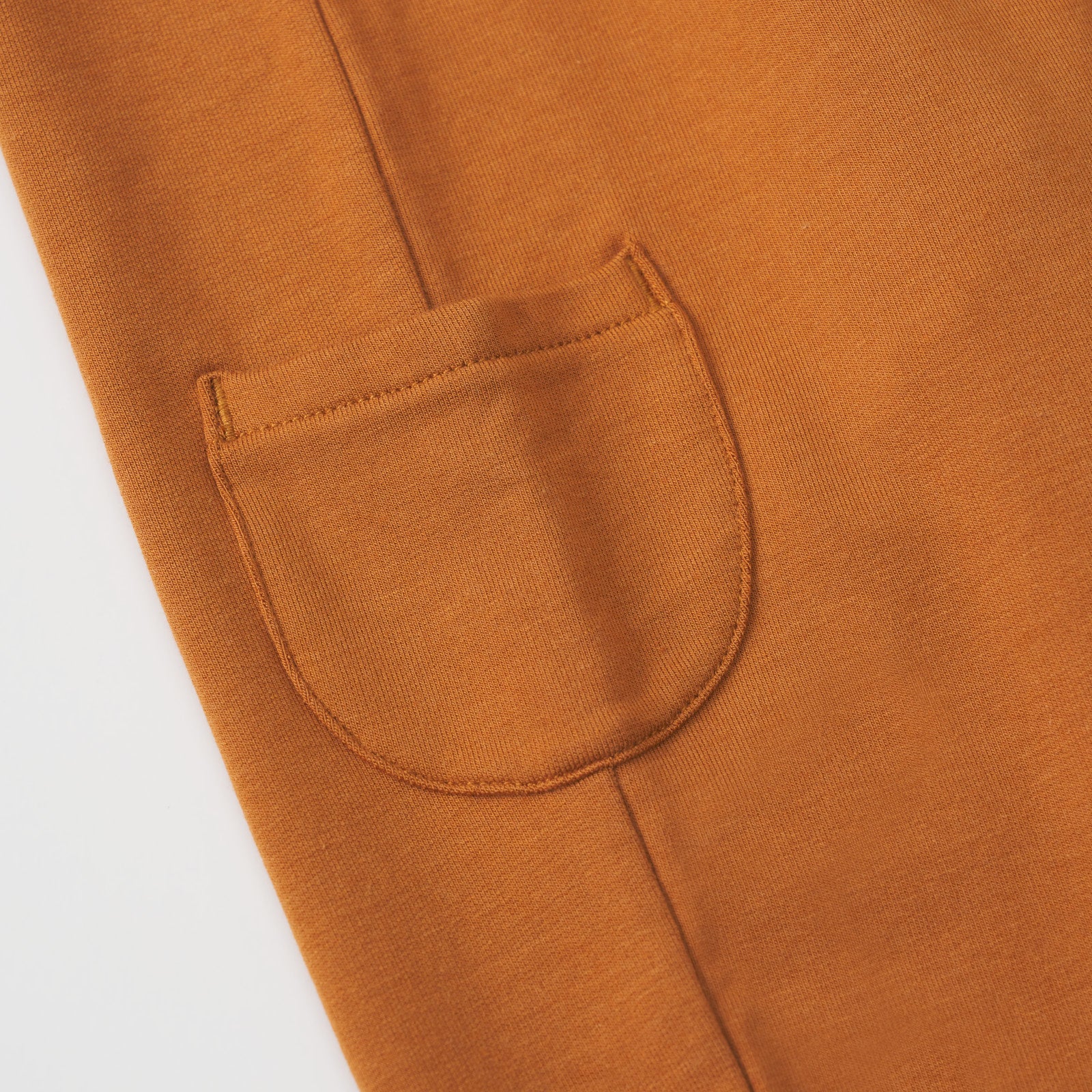 Close up view of a side pocket on a Golden Brown cinched jogger