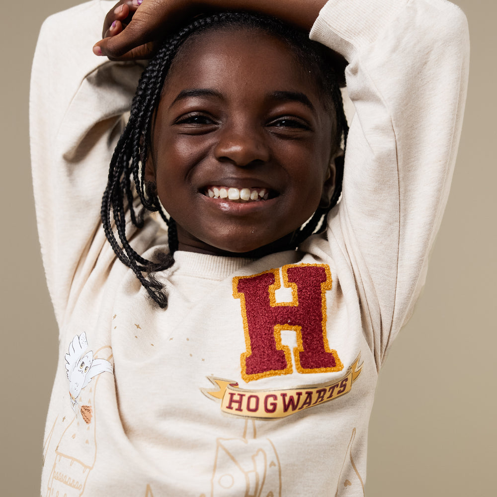 Alternate close up image of a child wearing a Harry Potter Drop Shoulder Crewneck