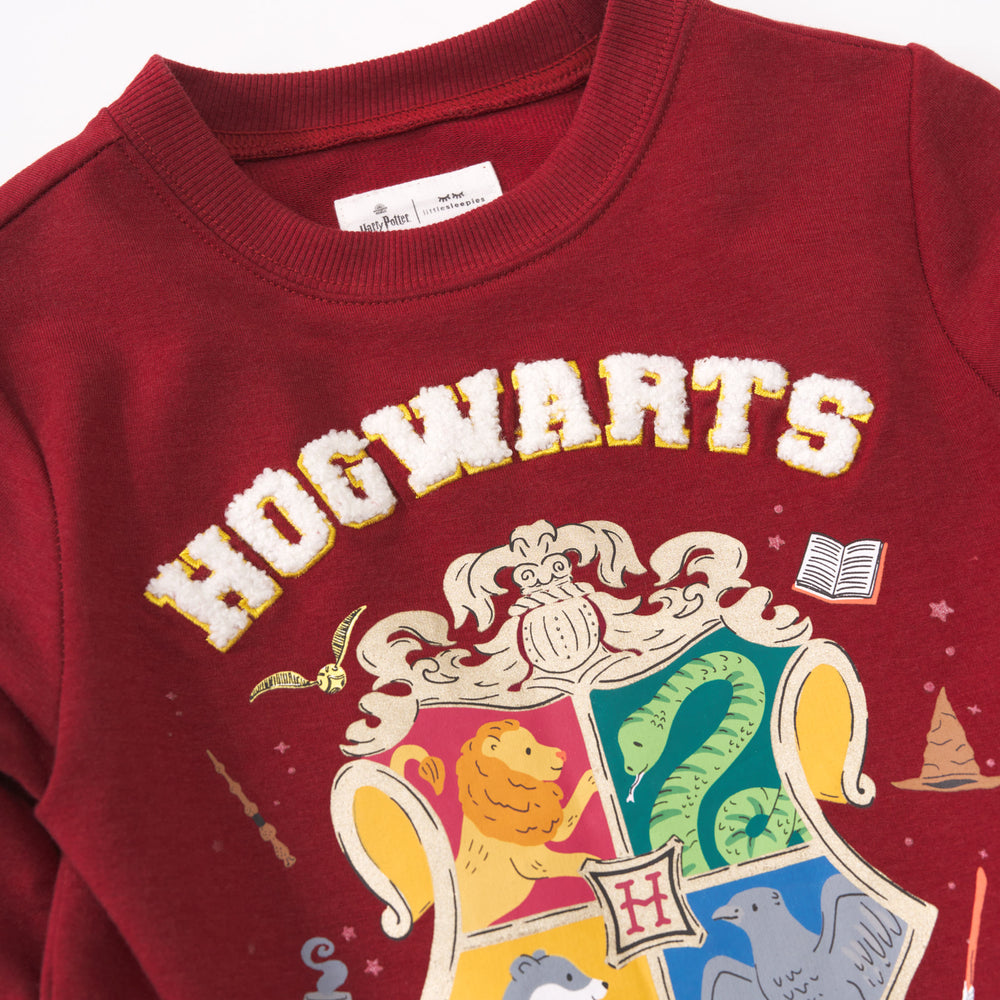 Close up detail shot of a Hogwarts Crewneck Sweatshirt