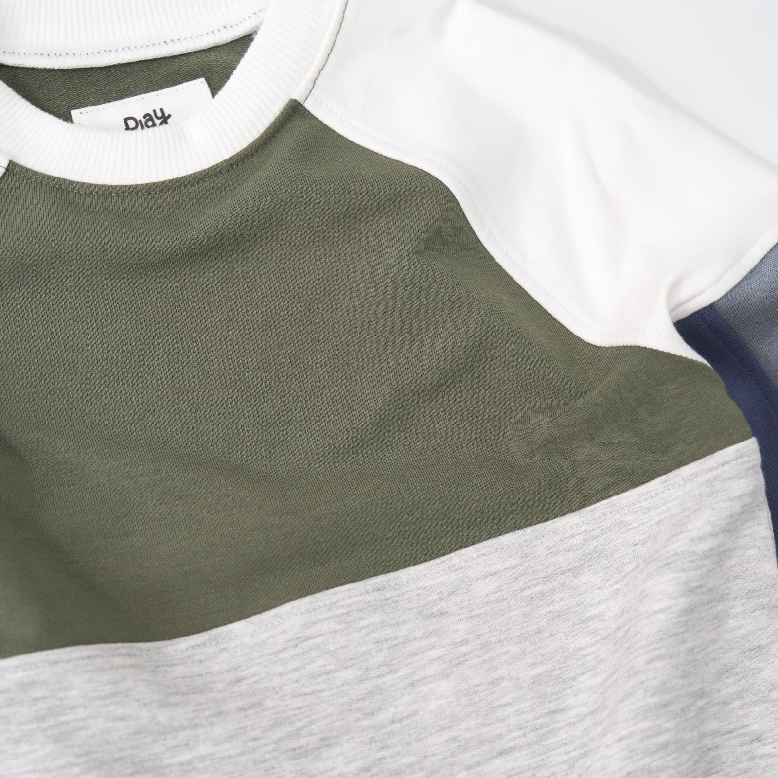 Close up detailed shot of a Olive Panel Crewneck