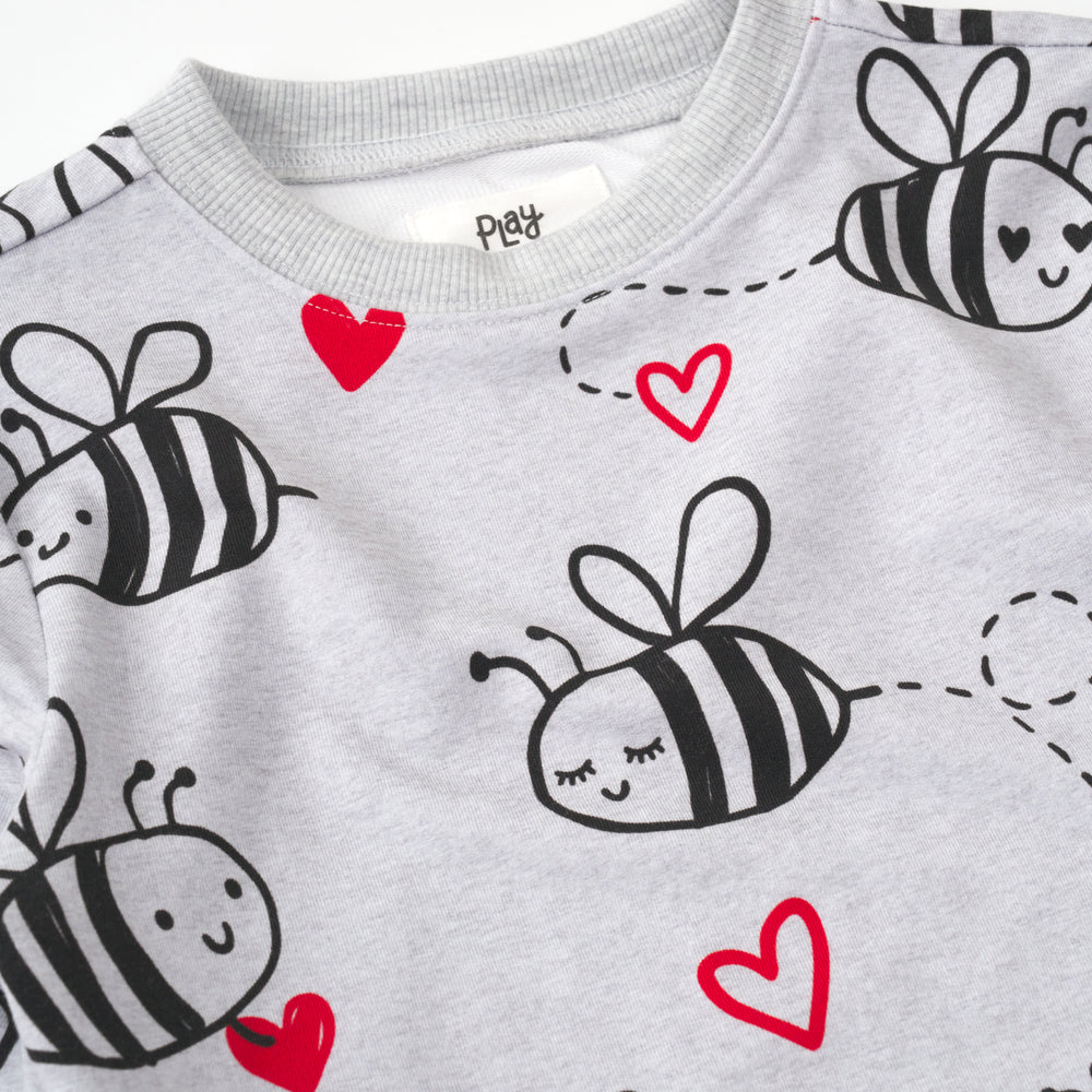 close up flat lay of a bee mine crewneck sweatshirt