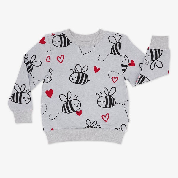 flat lay of a bee mine crewneck sweatshirt featuring black drawings of bees and red hearts on a gray background