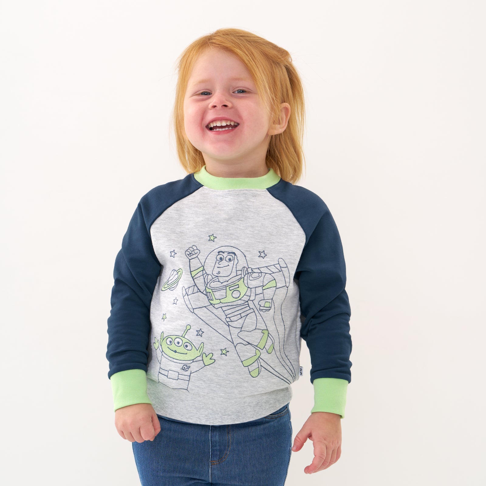 Alternate close up image of a child wearing a Disney Pixar Buzz Lightyear crewneck sweatshirt